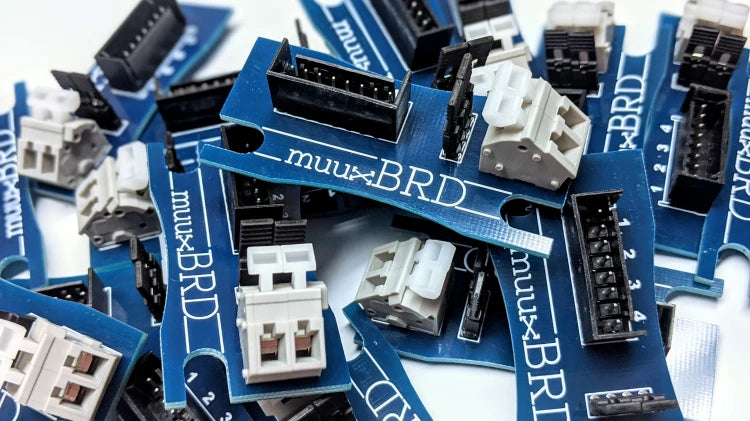 A pile of QuickSplit-4 series breakout boards.