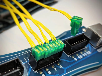 Close up of the FT-12 QuickPlug 12-cue slat for fireTEK with QuickConnect ematches installed