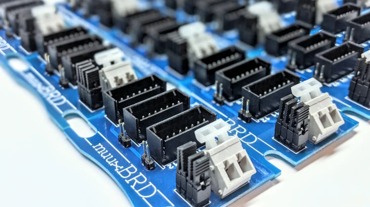 Many QS-12 breakout boards aligned into rows and columns