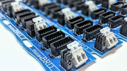 Many QS-12 breakout boards aligned into rows and columns