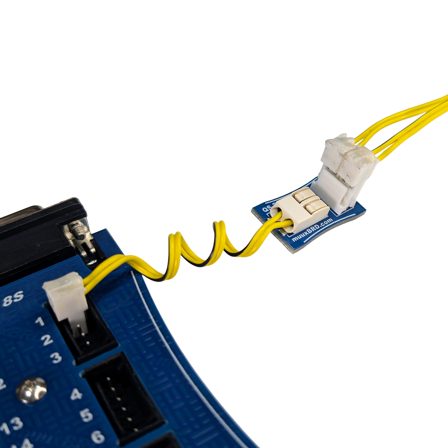 QuickSplit-2P breakout board connected to a slat, and two parallel wired QuickPlug electric matches. 