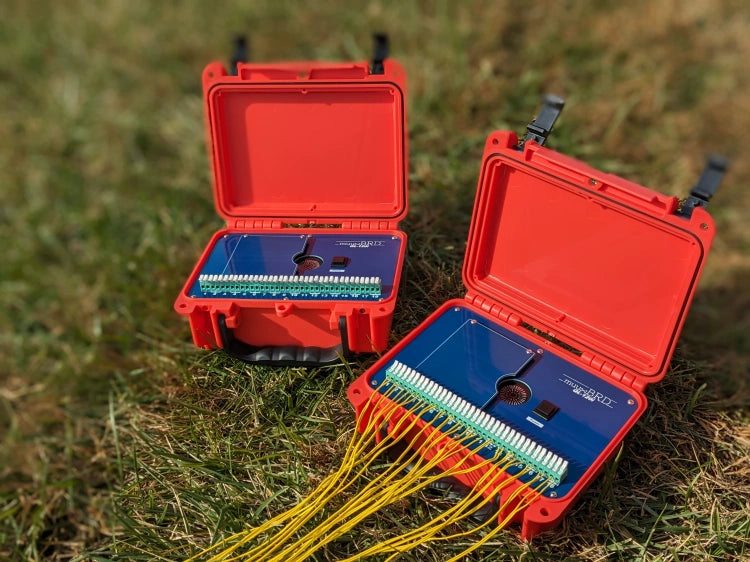 Pair of QL-120i QuickLever IGNITE i18 modules outside in the grass