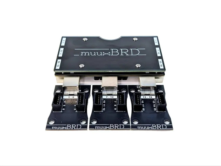 RJ-3P RJ45 breakout board for the IGNITE i18 firing system along side three QuickPlug 6-cue slats
