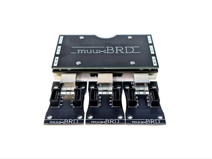 RJ-3P RJ45 breakout board for the IGNITE i18 firing system along side three QuickPlug 6-cue slats