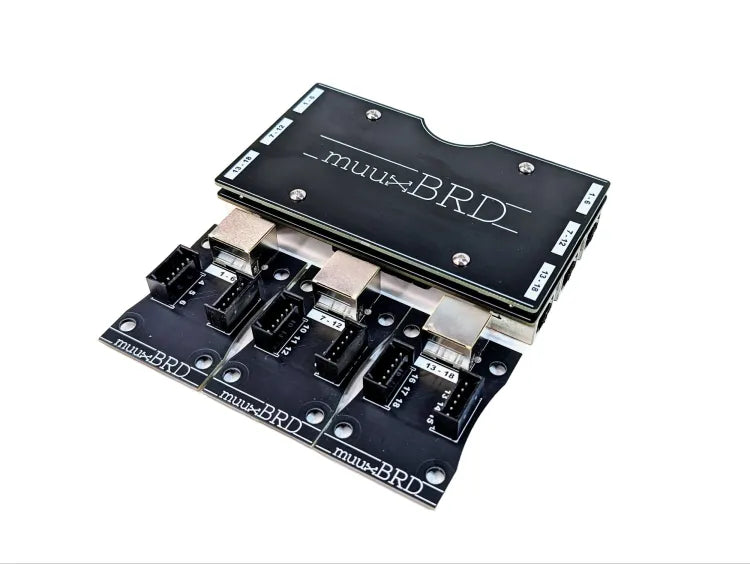 RJ-3P RJ45 breakout board for the IGNITE i18 firing system along side three 6-cue QuickPlug slats