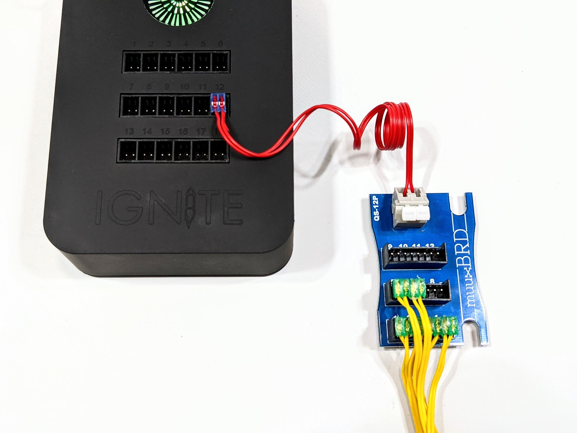 IGNITE i18 connected to a QS-12P breakout board, and several MJG ematches wired in parallel