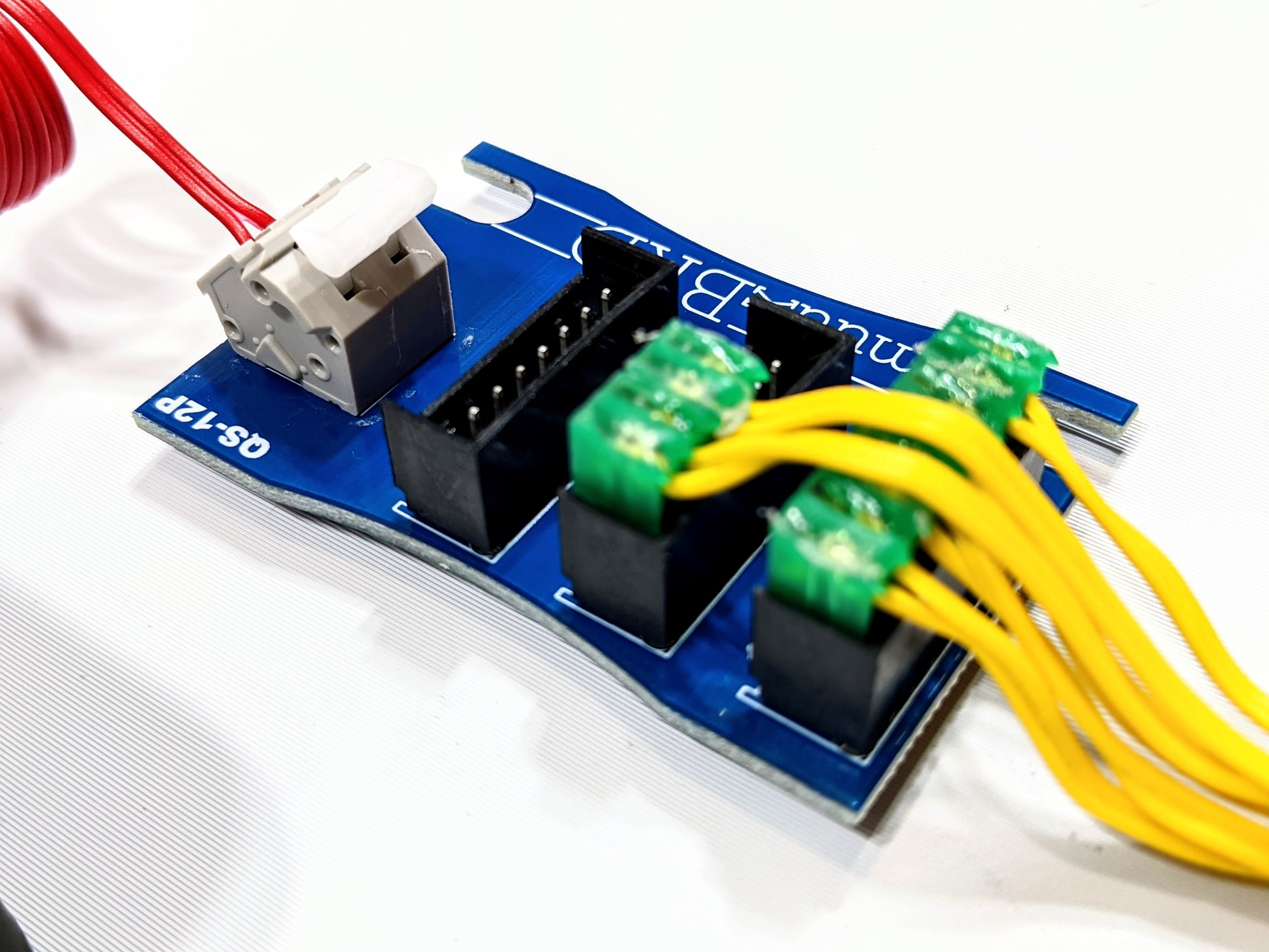 QuikcSplit-12P breakout board, and several MJG ematches wired in parallel