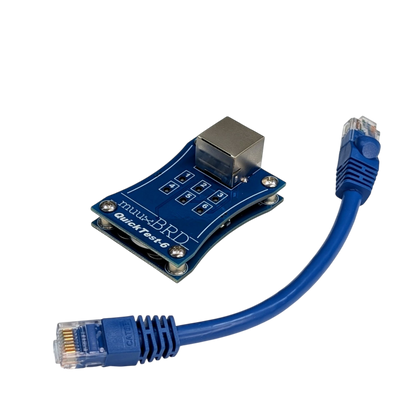 QT-6 along side a short CAT5 cable for connecting your 6-cue slats