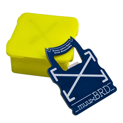 muuxBRD Bottle Opener leaning against a slat enclosure