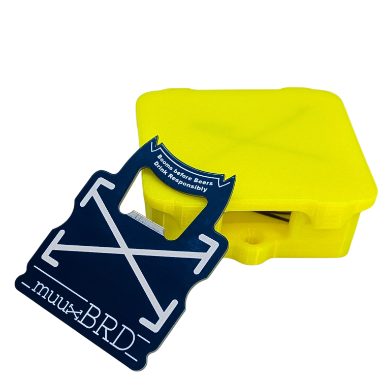 muuxBRD Bottle Opener leaning up against a slat enclosure