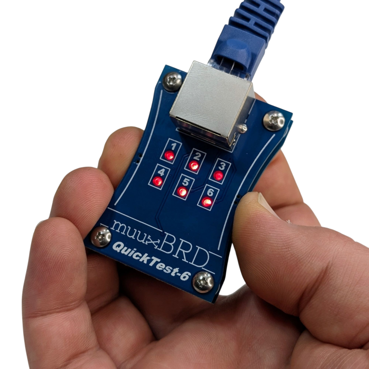 Holding the QT-6 ematch tester for use with 6-cue RJ45 slats