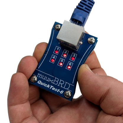 Holding the QT-6 ematch tester for use with 6-cue RJ45 slats